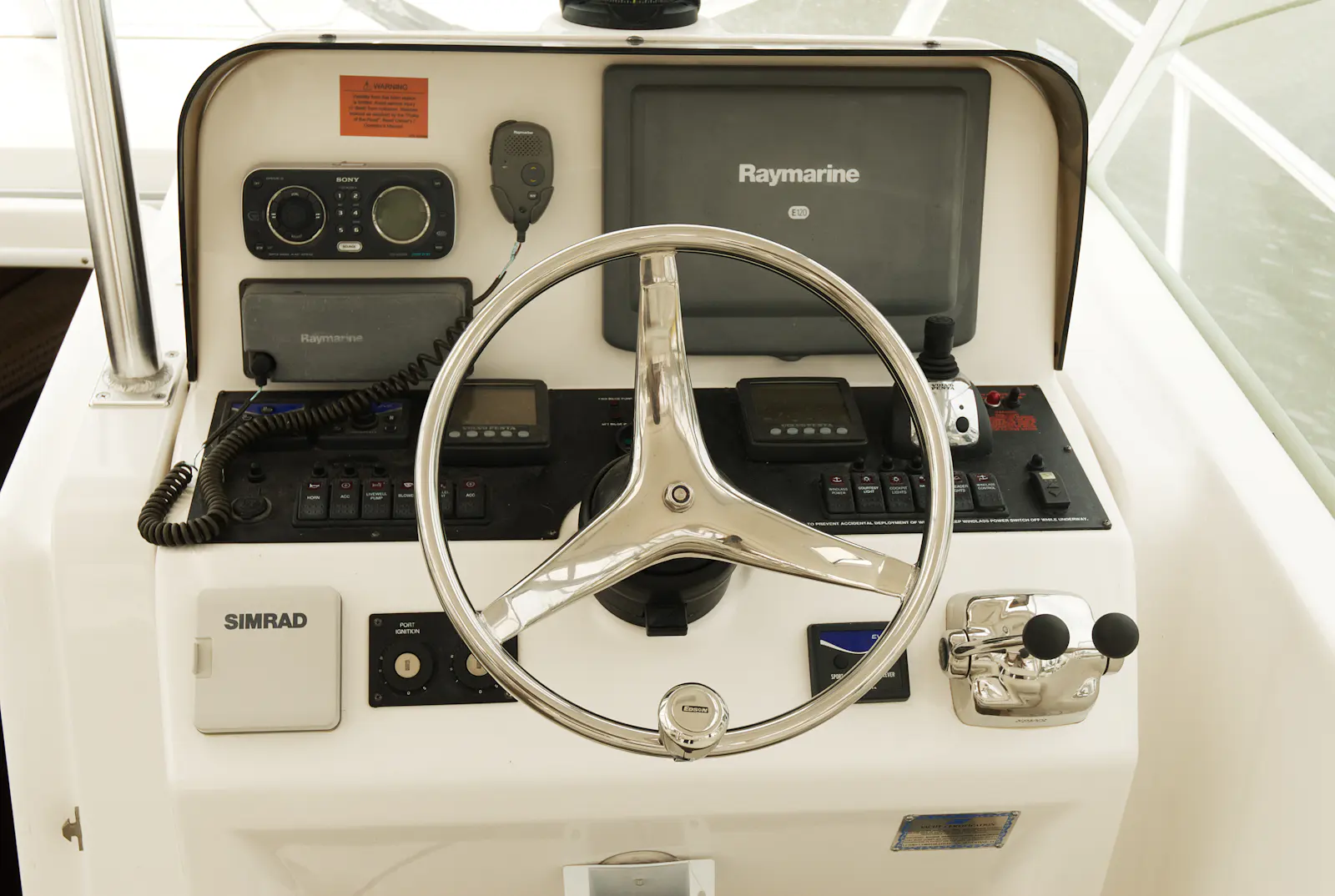 The helm of a sportfishing yacht with navigation electronics